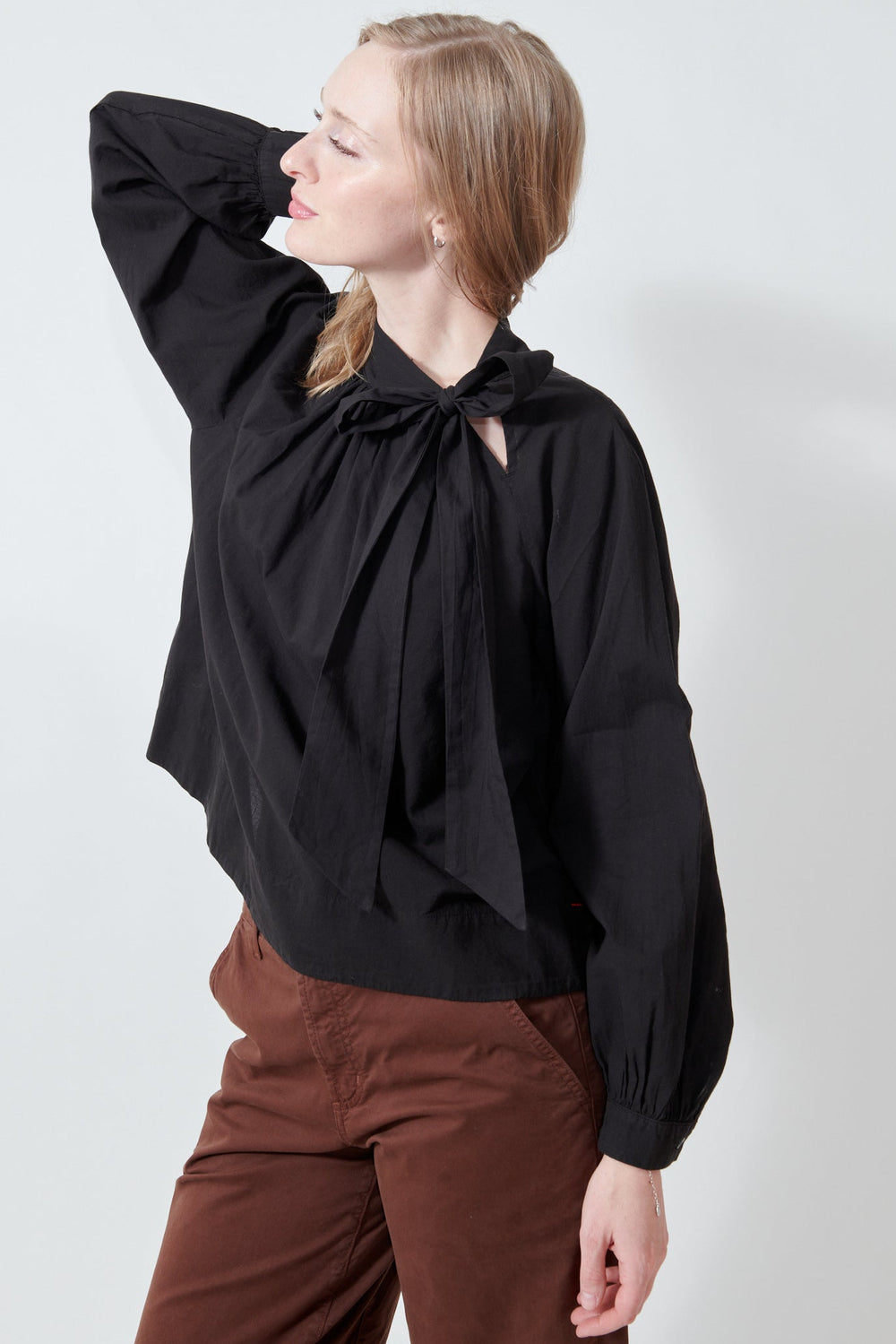 Madi wearing Xirena Leona Top side view