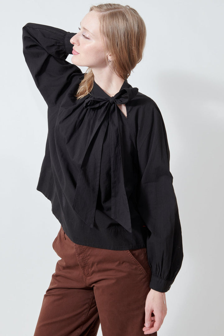 Madi wearing Xirena Leona Top side view