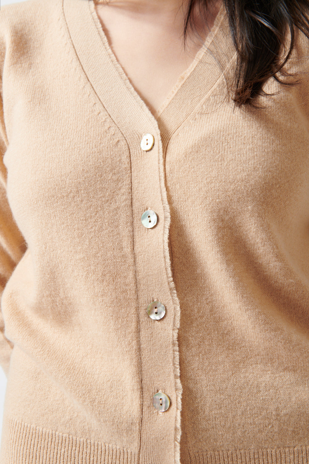 Lilly wearing Jumper 1234 Distressed Vee Cardigan front/detail view