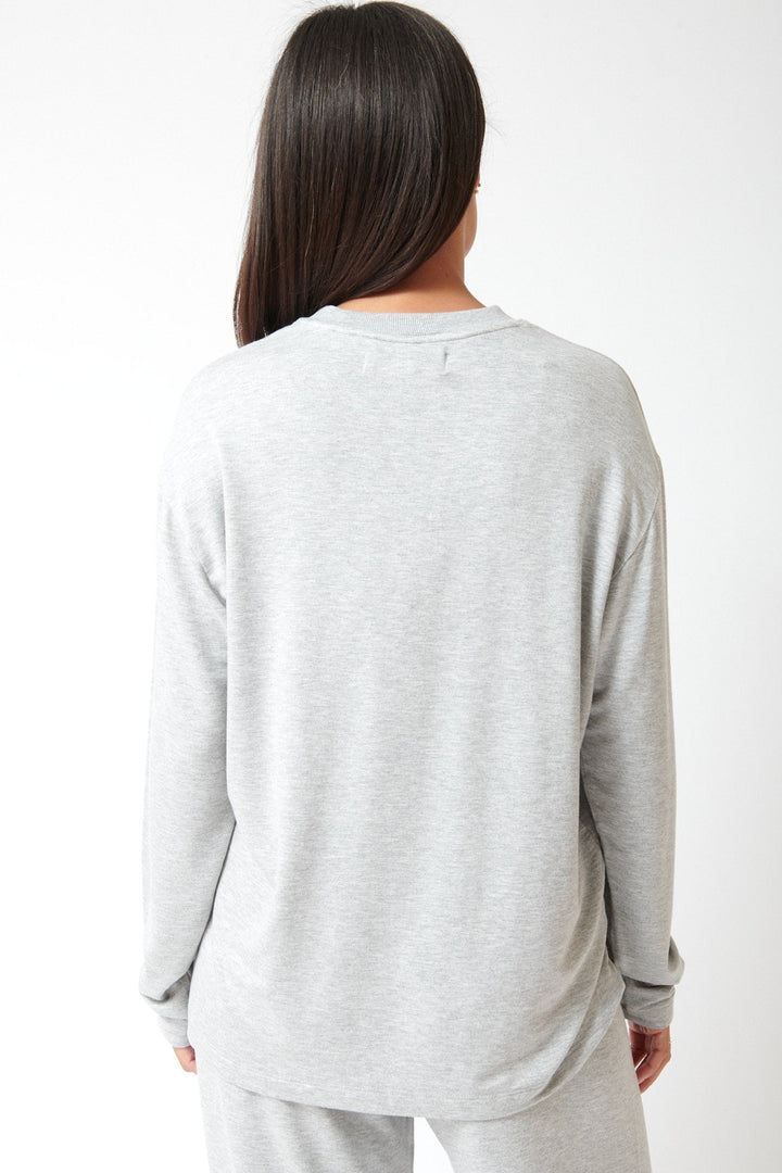 Amanda wearing SPRWMN Long Sleeve Oversized Tee rear view