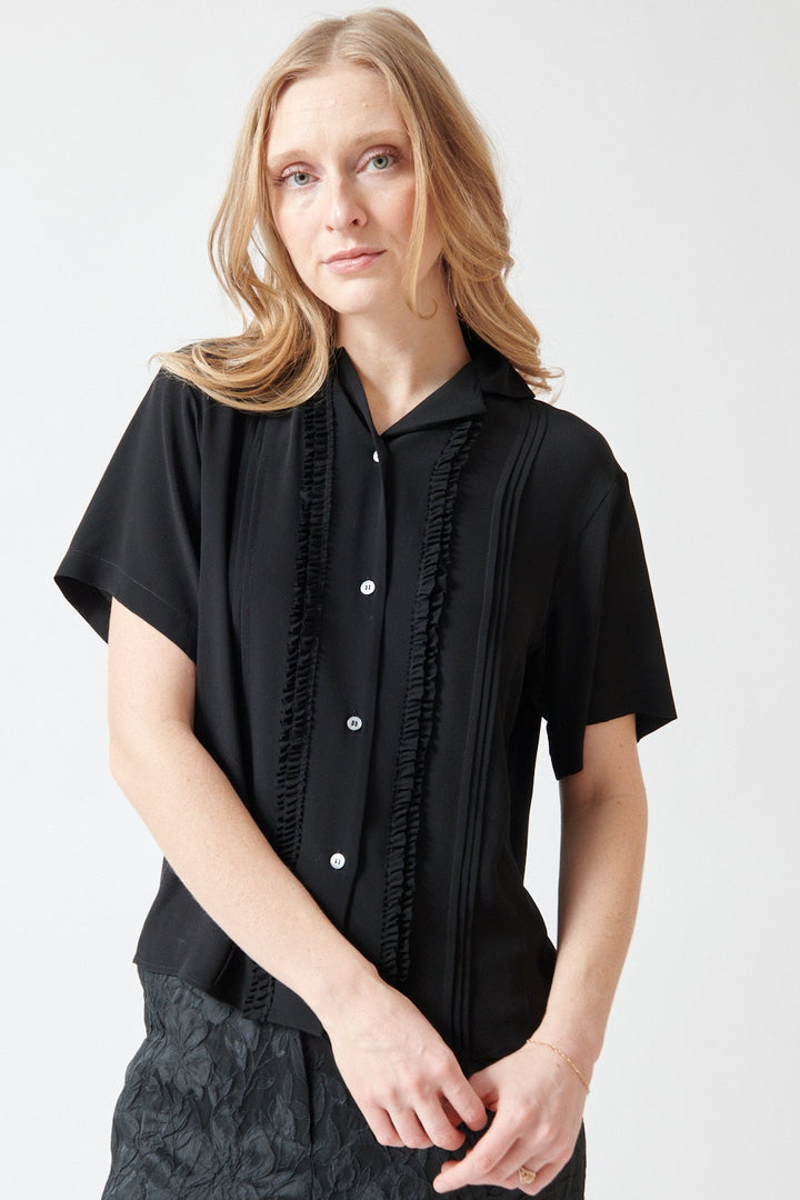 Madi wearing N°21 Short Sleeve Acetate Silk Ruffle Blouse front view