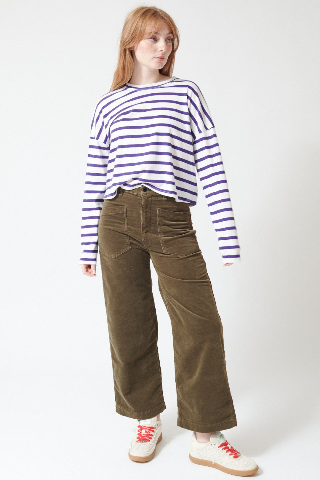 Waverly wearing ASKK NY Virginia Corduroy Pant in Safari Green, front view.