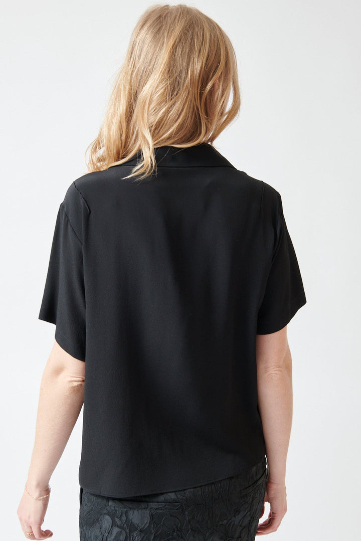 Madi wearing N°21 Short Sleeve Acetate Silk Ruffle Blouse rear view