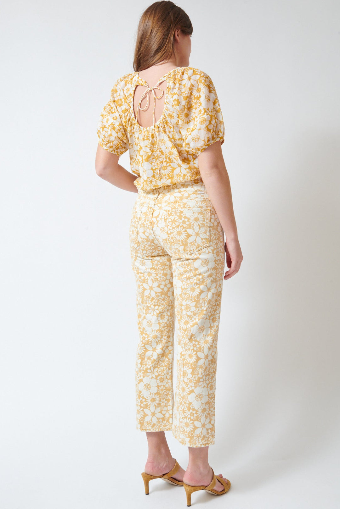 Julia wearing Mother Denim The Mid Rise Rambler Zip Ankle rear view