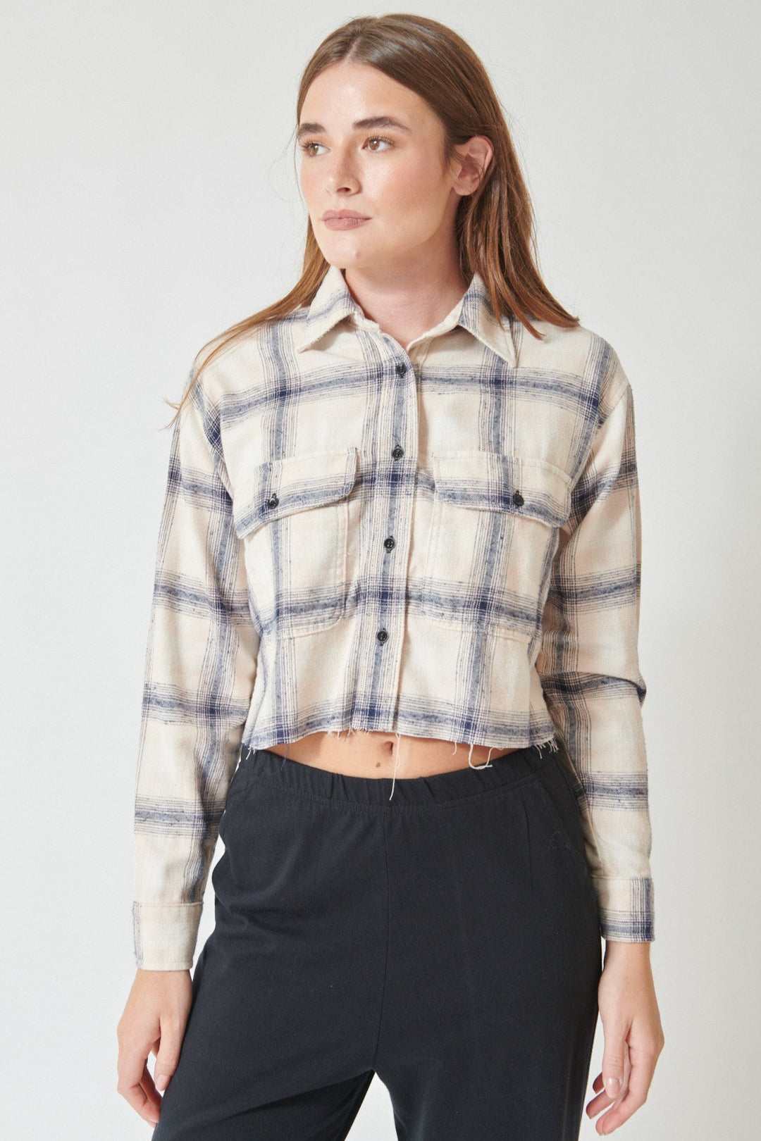 Julia wearing ASKK NY Crosby Flannel Shirt in pink plaid, front view.