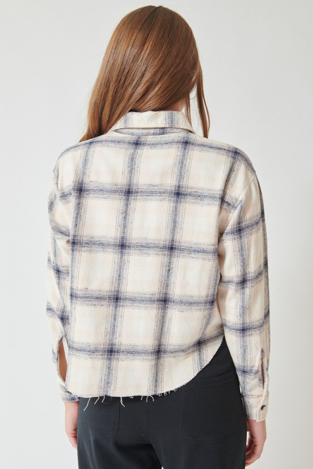 Julia wearing ASKK NY Crosby Flannel Shirt in pink plaid, back view.