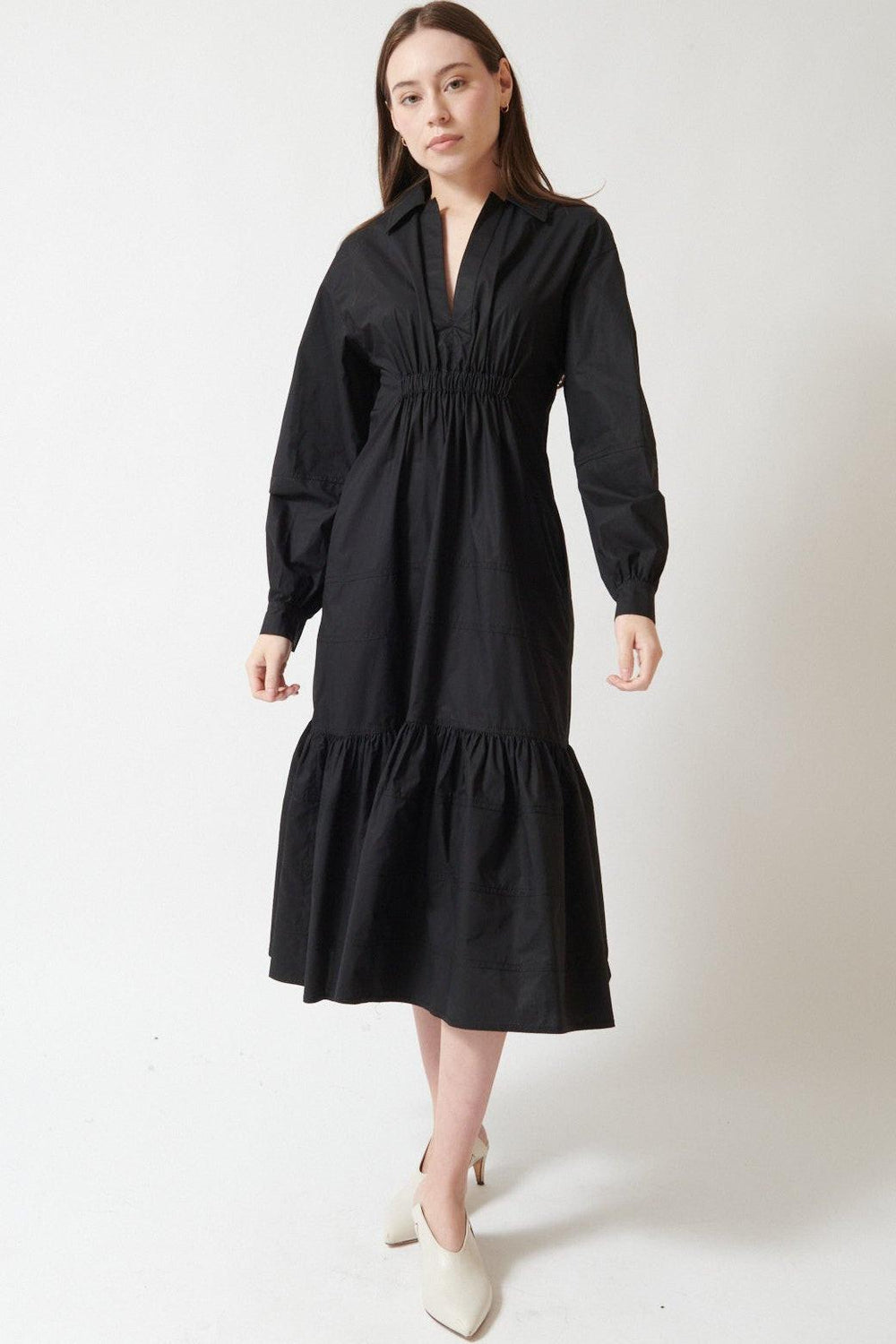 Angela wearing Mantu Elizabeth Tailored Dress With Flowing Hemline front view