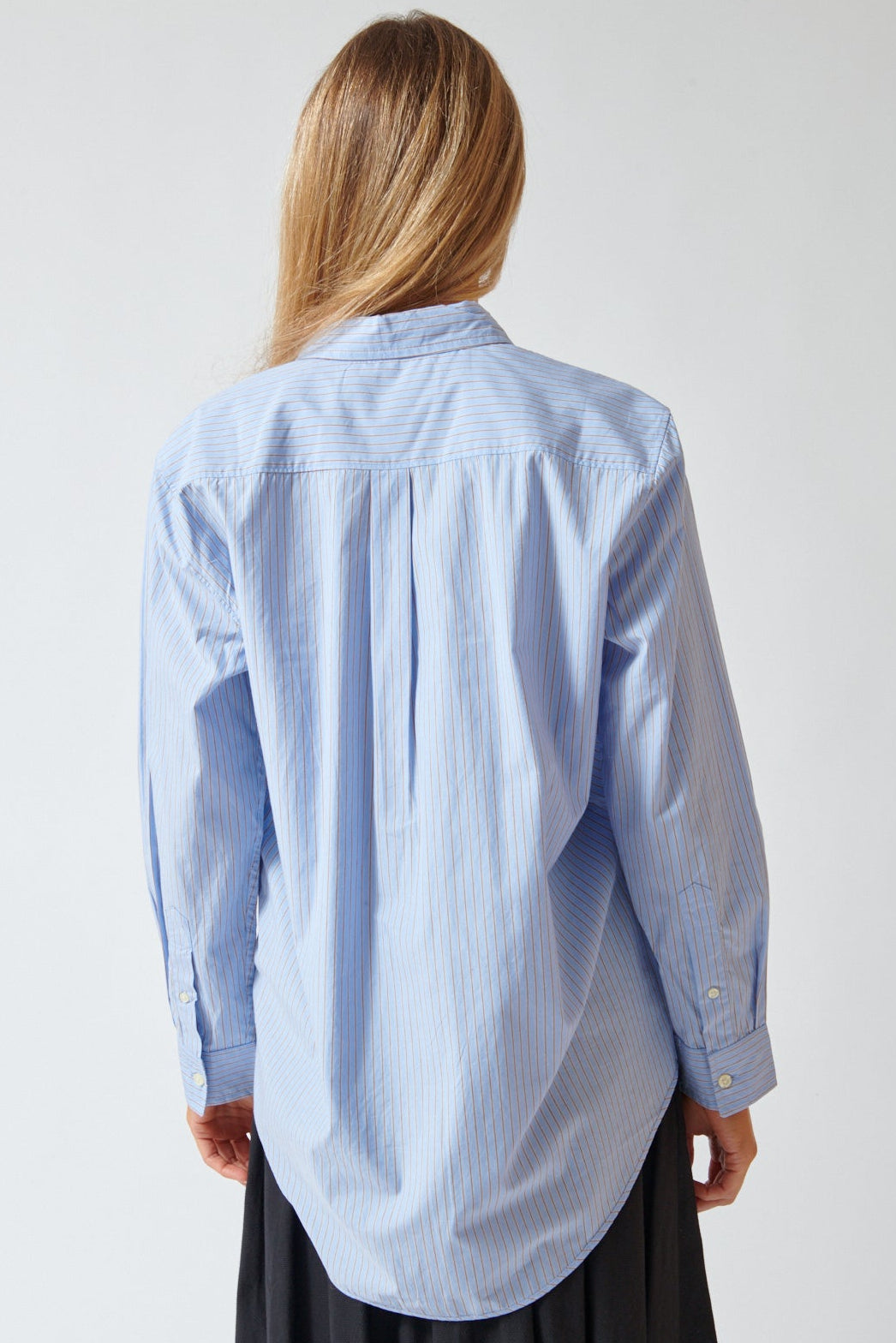 Mari wearing The Great The Menswear Button Up rear view