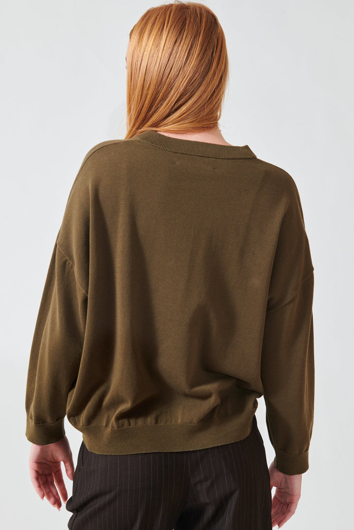Aysia wearing The Great The Henley Sweater rear view