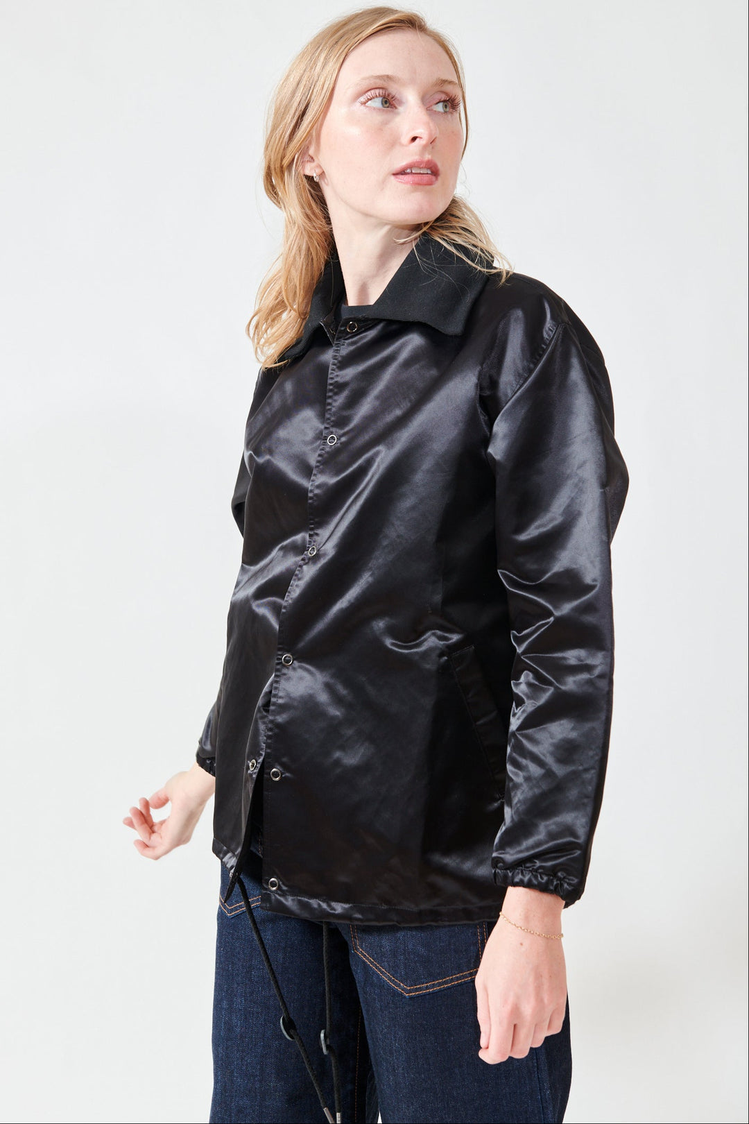 Madi wearing The Great The Satin Coachs Jacket front/side view