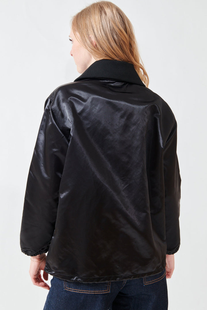 Madi wearing The Great The Satin Coachs Jacket rear view