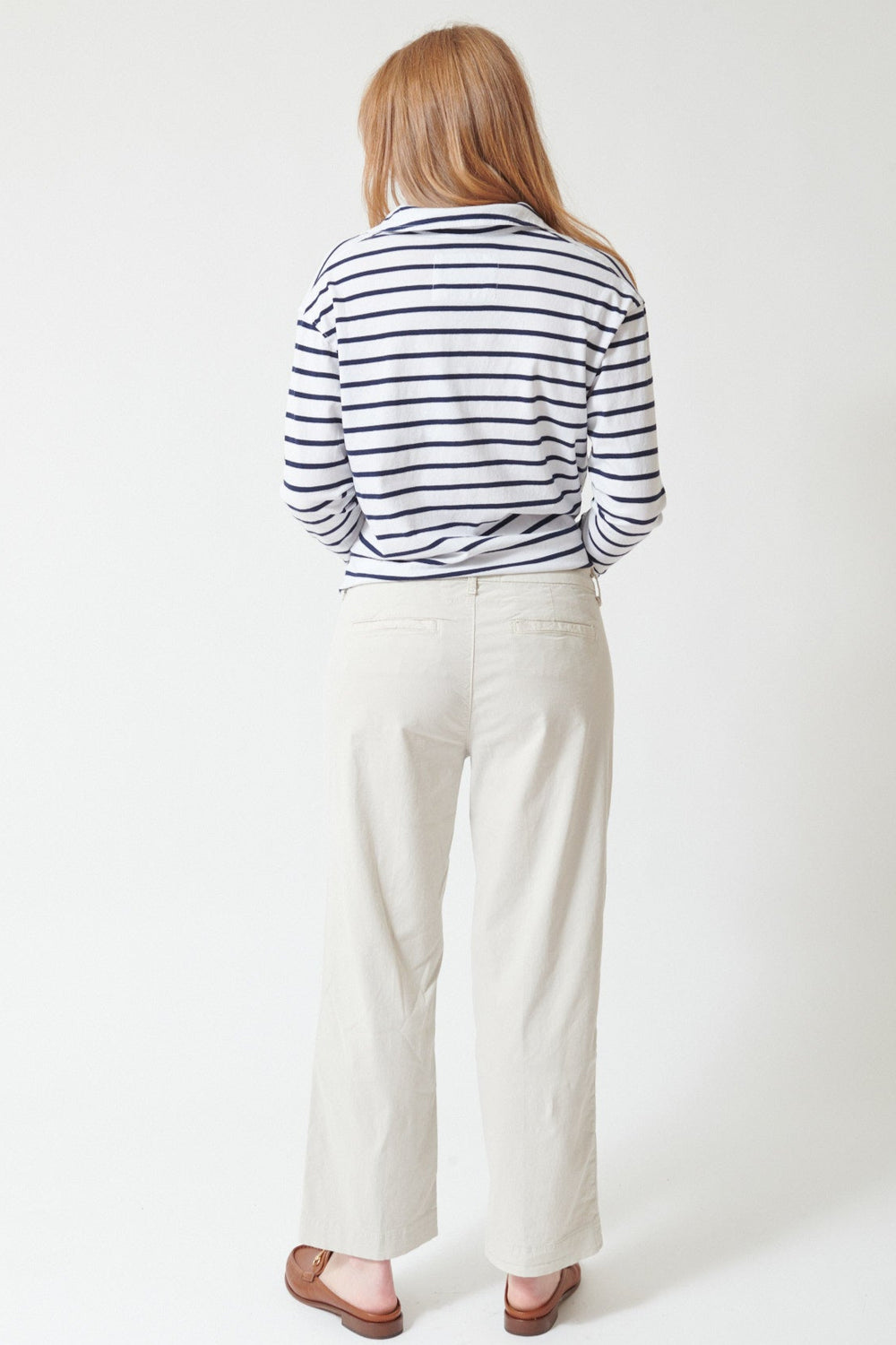Waverly wearing Frank & Eileen Westport The Italian Wide Leg Chino in Cement, rear view.