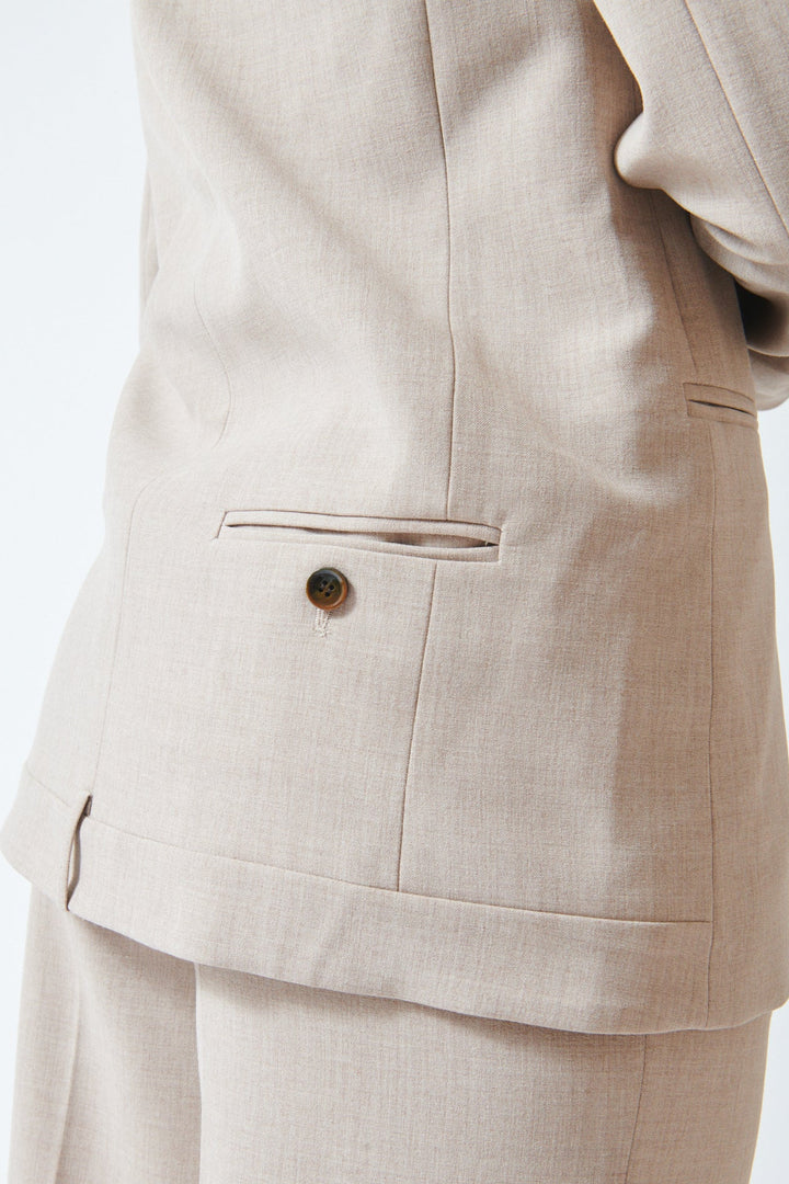 Julia wearing The Garment Pisano Tuxedo Beige Melange rear/ detail view