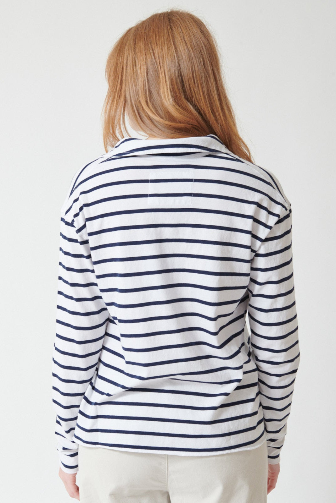 Waverly wearing Frank & Eileen Patrick Popover Henley Top in White Navy Stripe, rear view.