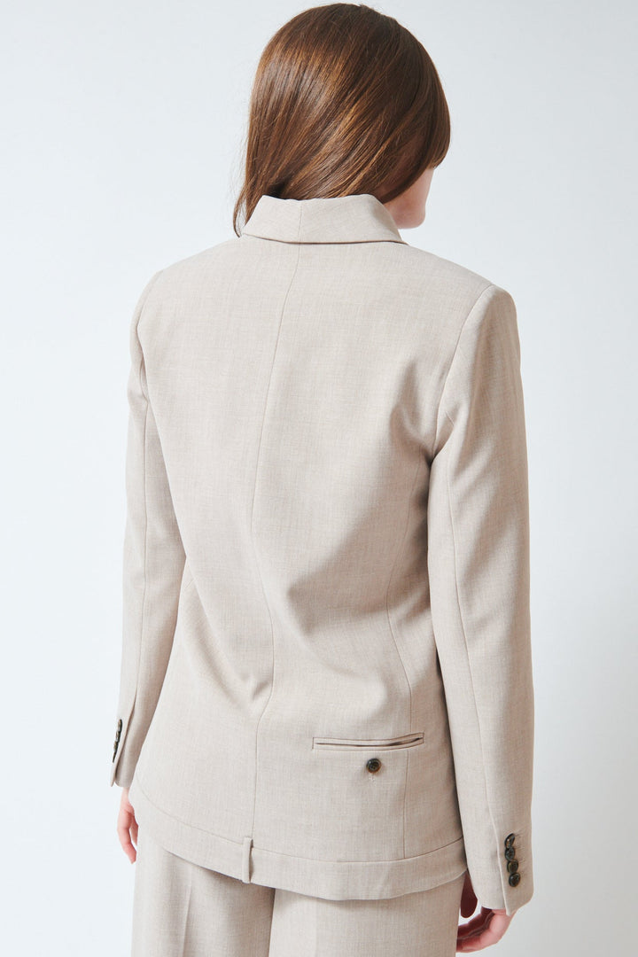 Julia wearing The Garment Pisano Tuxedo Beige Melange rear view
