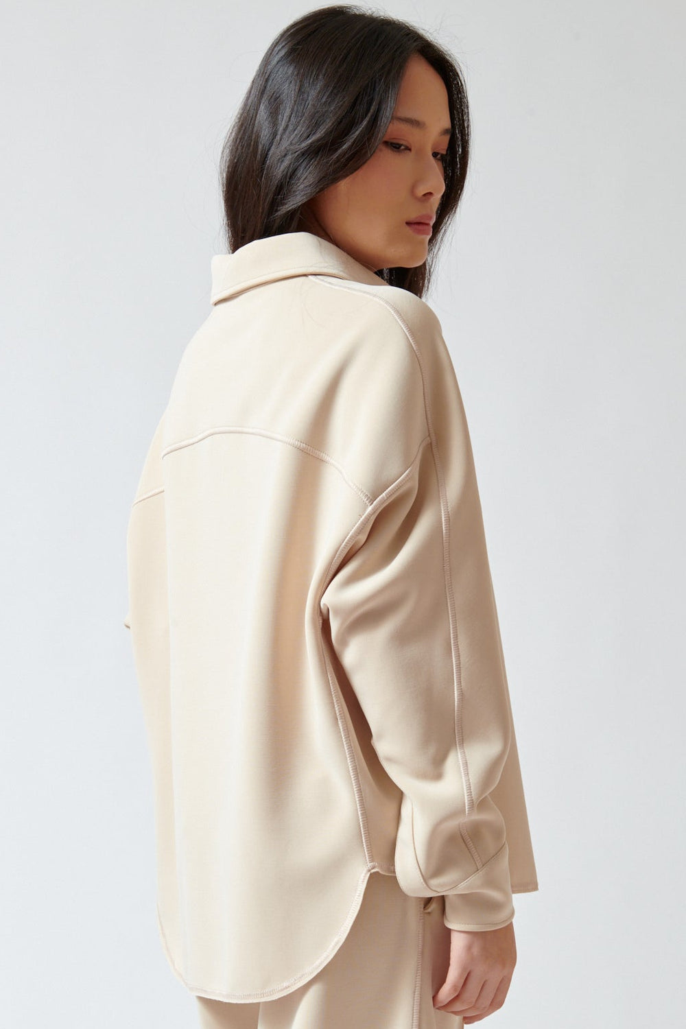 Lilly wearing Momoni Lilac Blouse side/rear view