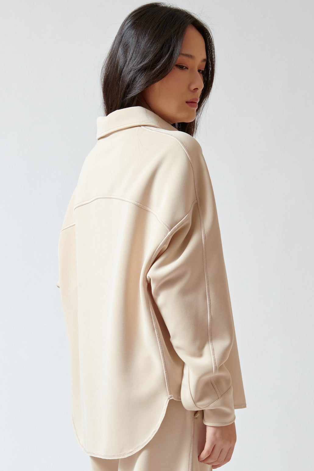 Lilly wearing Momoni Lilac Blouse side/rear view