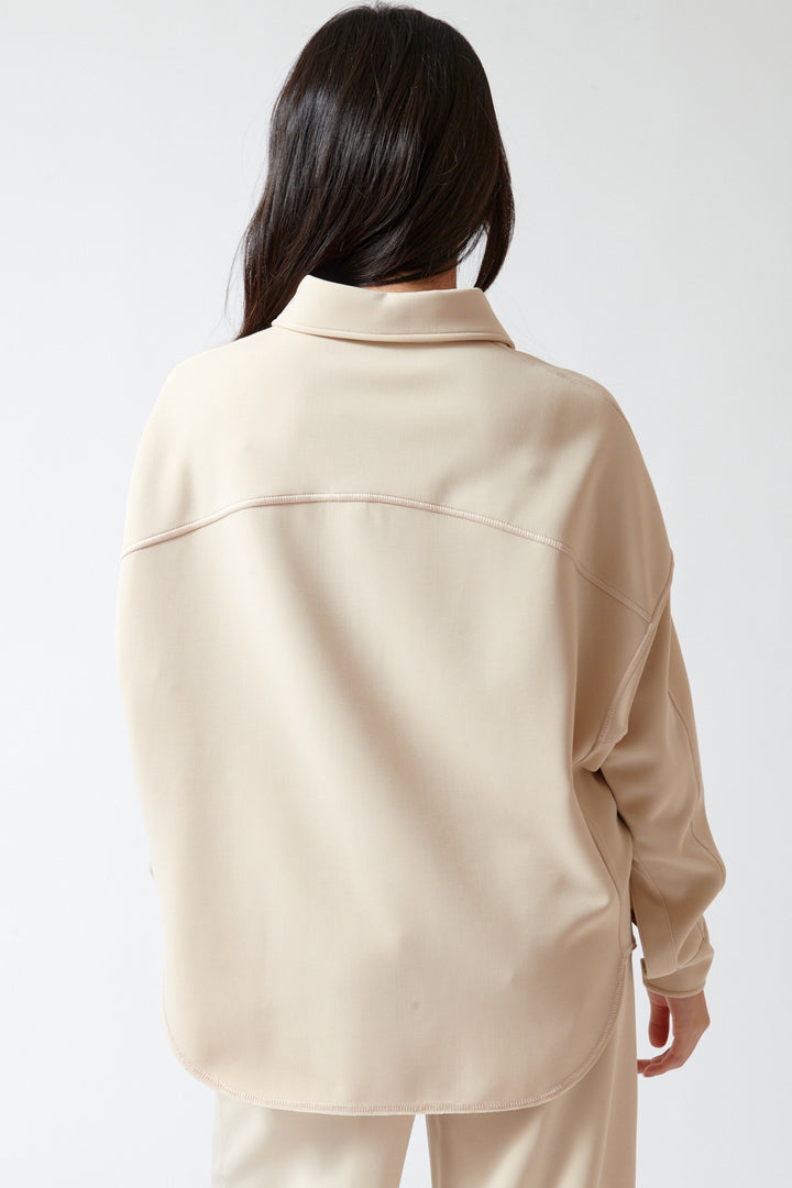 Lilly wearing Momoni Lilac Blouse rear view