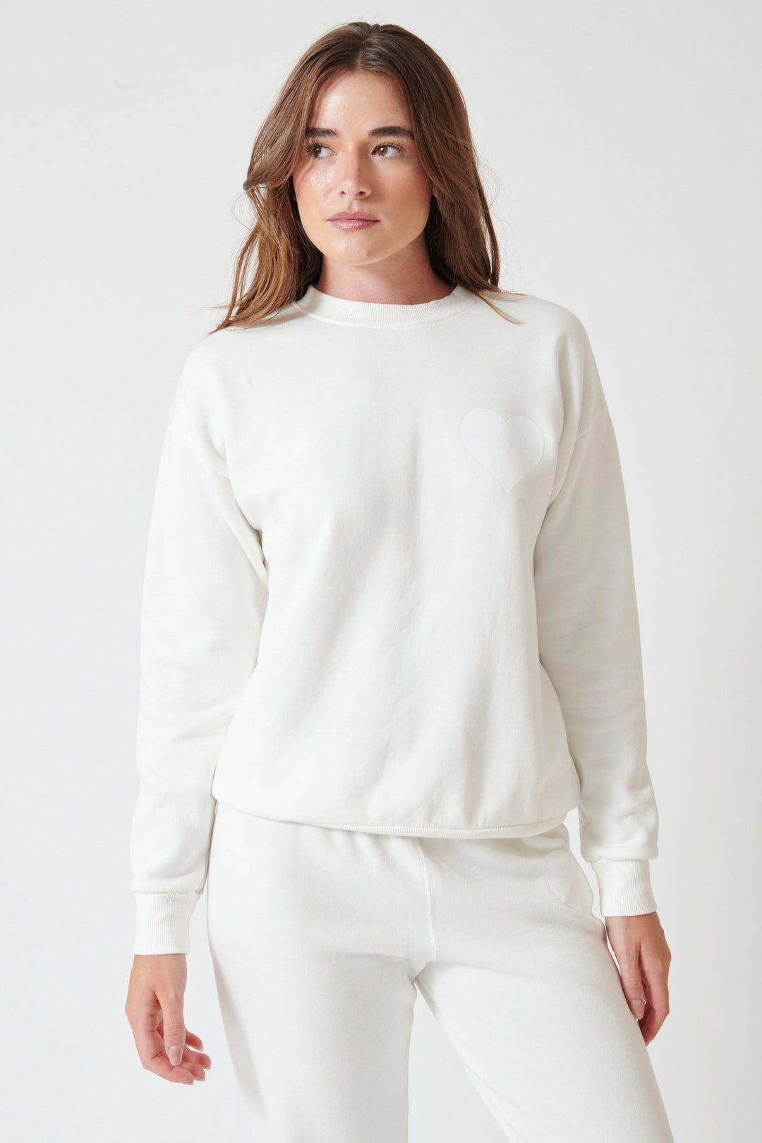 Julia wearing SPRWMN Heart Sweatshirt front view