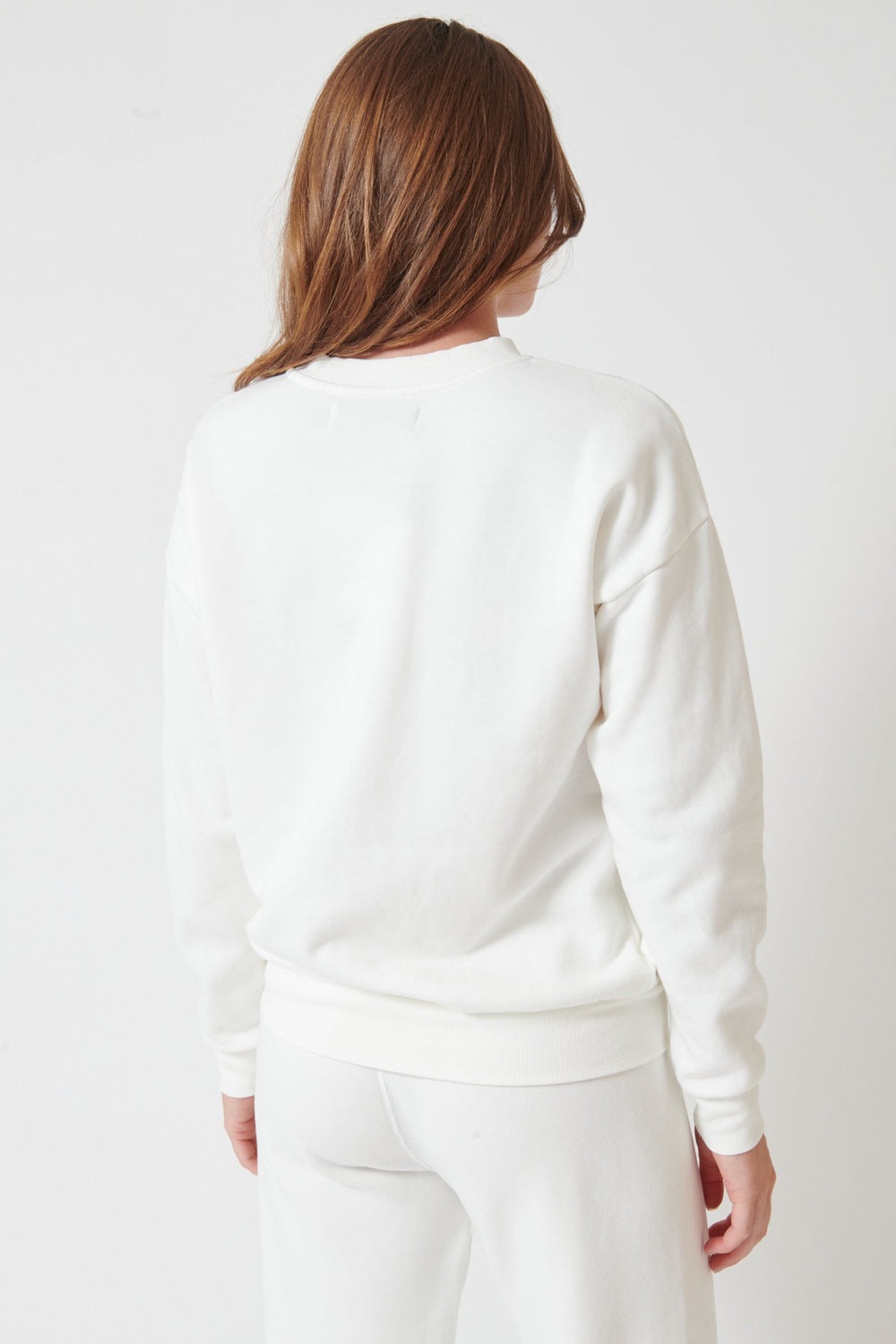 Julia wearing SPRWMN Heart Sweatshirt rear view