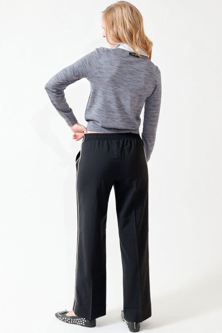 Madi wearing WE-AR4 The Chaplin Trouser rear view