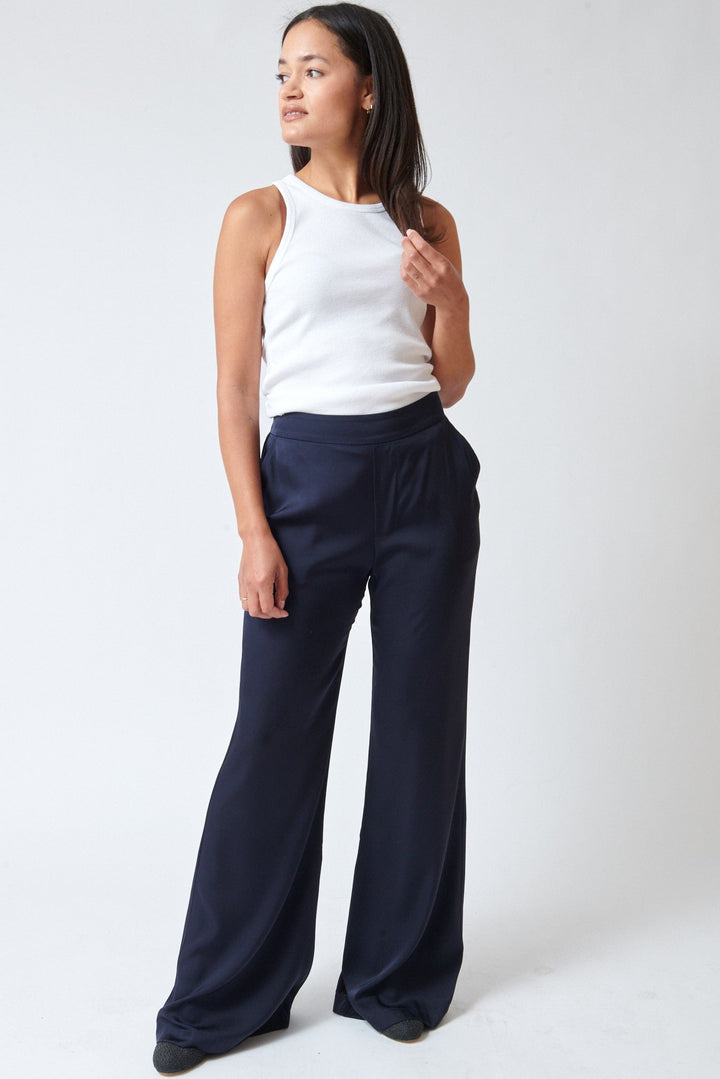 Amanda wearing Allude Touch On Silk Elastane Trousers Deep Night front view
