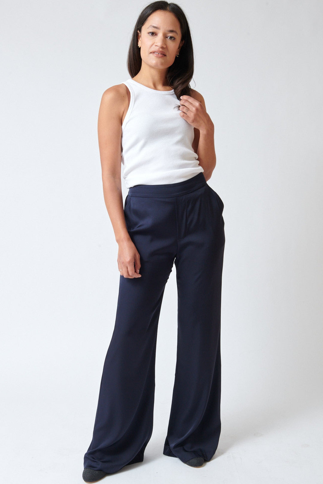 Amanda wearing Allude Touch On Silk Elastane Trousers Deep Night front view