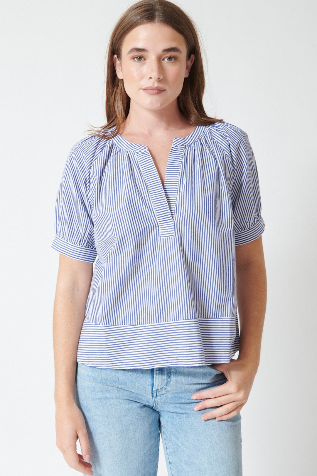 Julia wearing Xirena Josette Top in True Blue, rear view.
