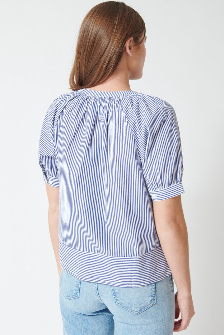 Julia wearing Xirena Josette Top in True Blue, rear view.