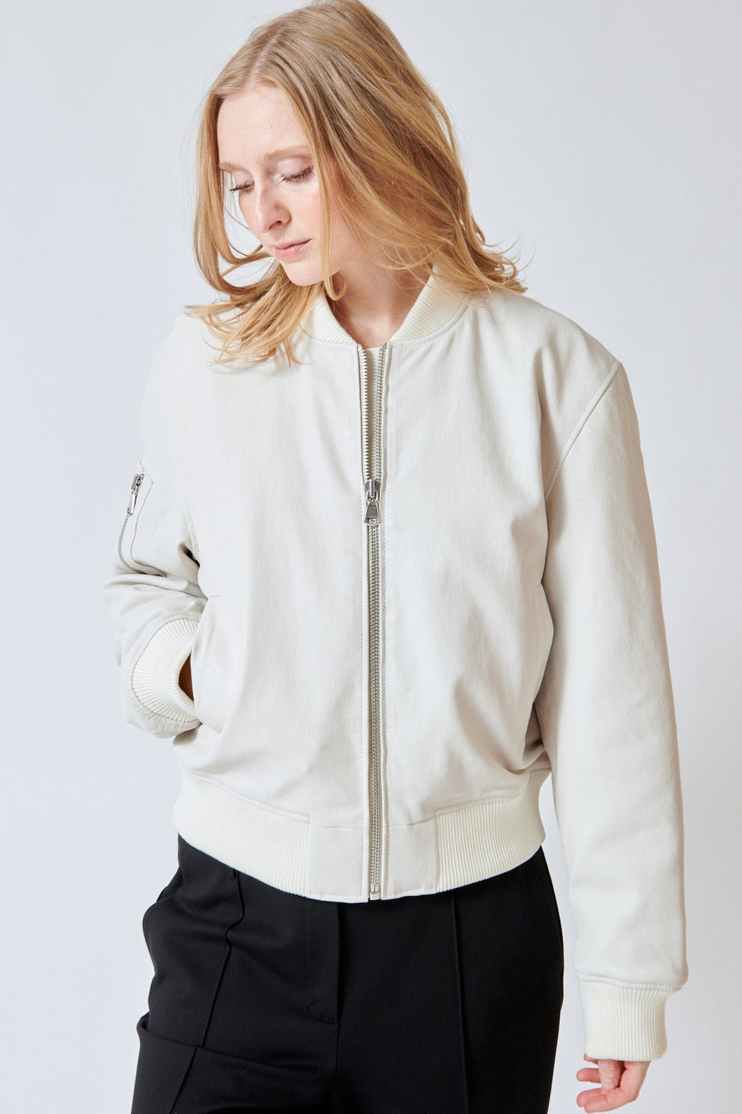 Maid wearing SPRWMN Bomber Jacket front view