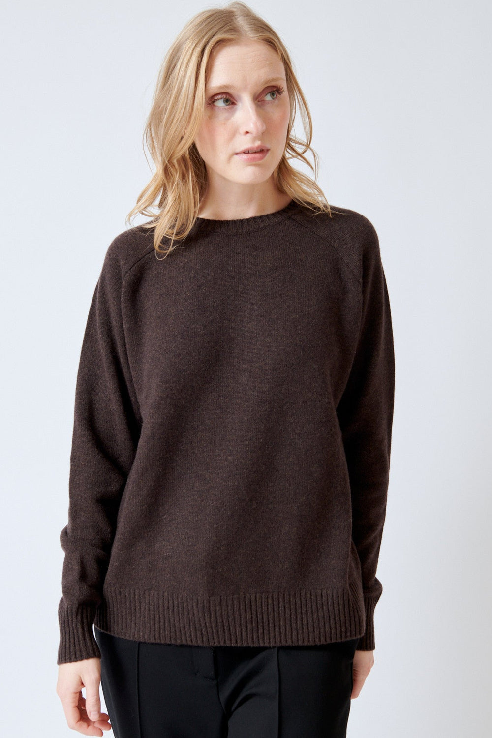 Madi wearing SPRWMN Classic Crew Sweater front view