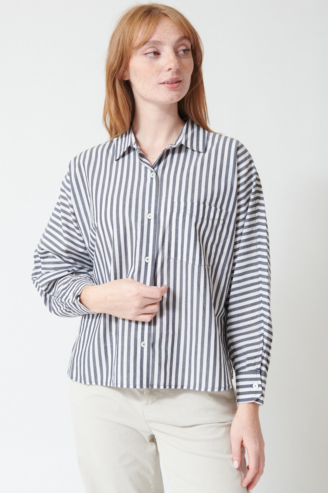 Waverly wearing Lilla P Dolman Sleeve Button Down Shirt in Navy White Stripe, front view.