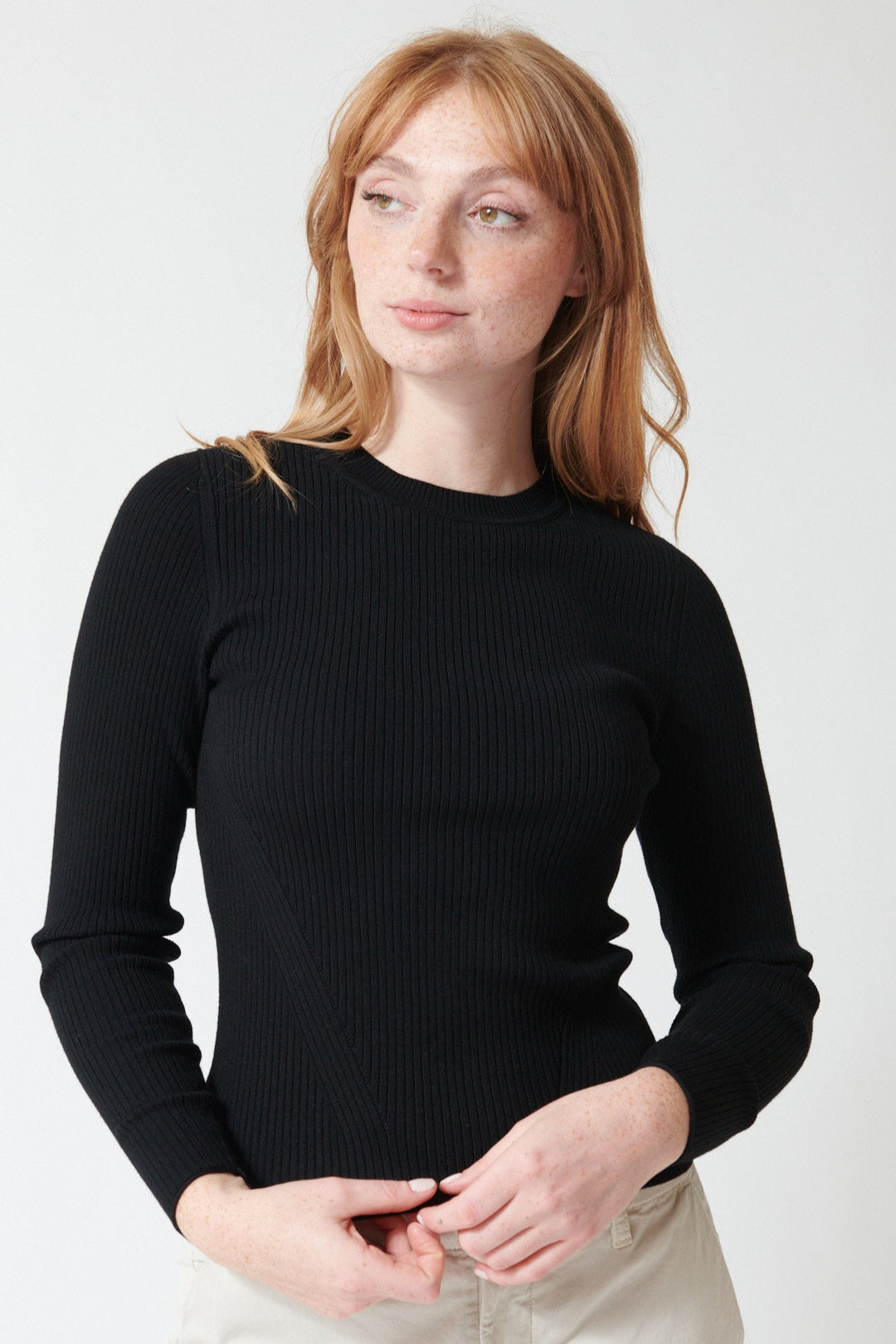 Waverly wearing Lilla P Fitted Crewneck Sweater in Black, front view.