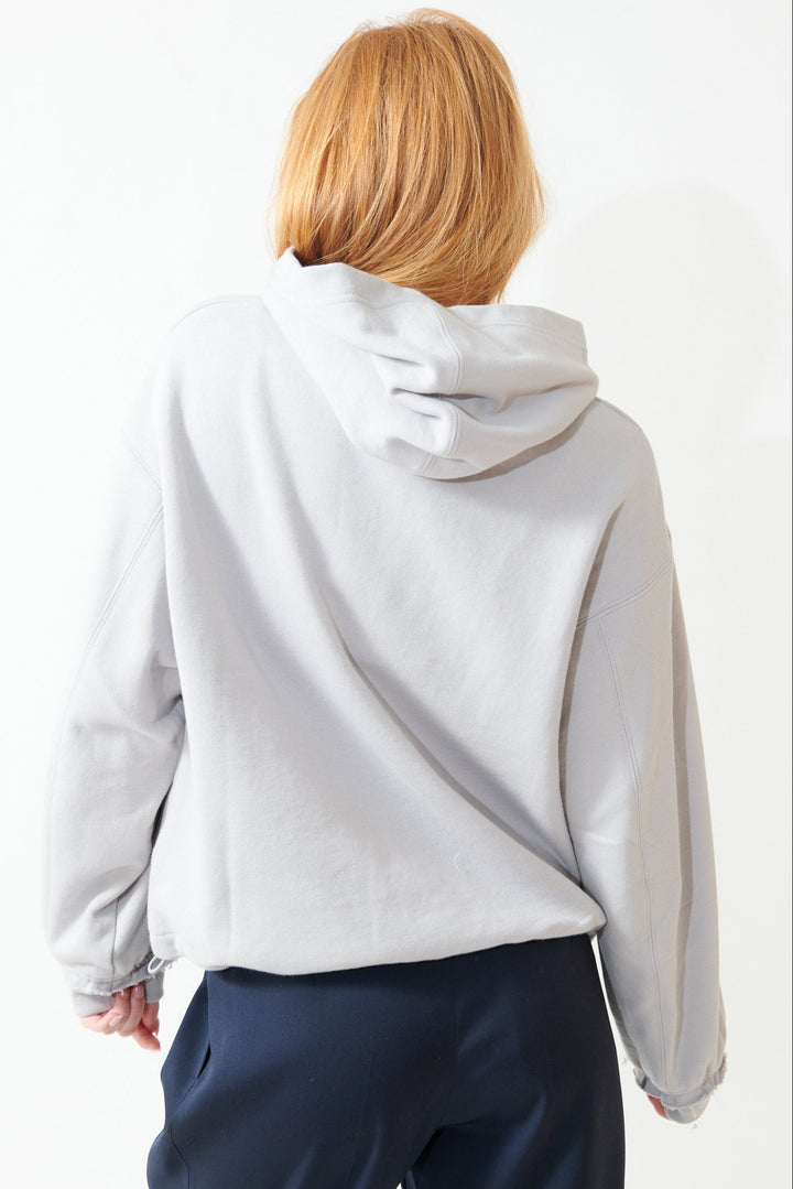 Aysia wearing WE-AR4 The Underground Hoodie rear view