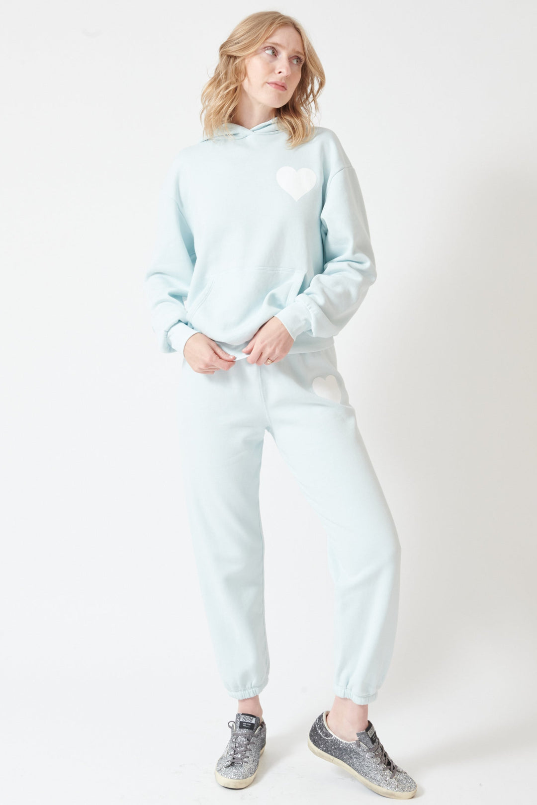 Madi wearing SPRWMN Heart Sweatpants front view