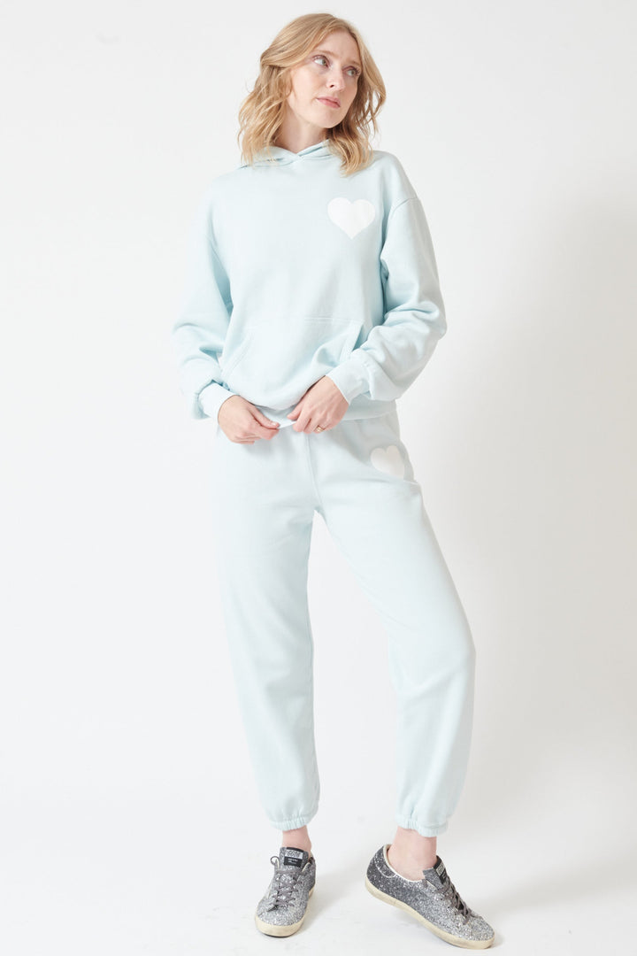 Madi wearing SPRWMN Heart Sweatpants front view