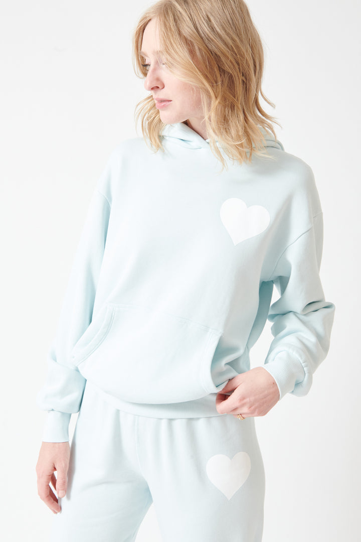 Madi wearing SPRWMN Heart Hoodie front view