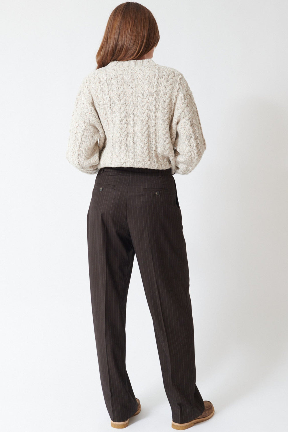 Julia wearing The Great The Menswear Trouser in Chocolate Stripe, rear view.