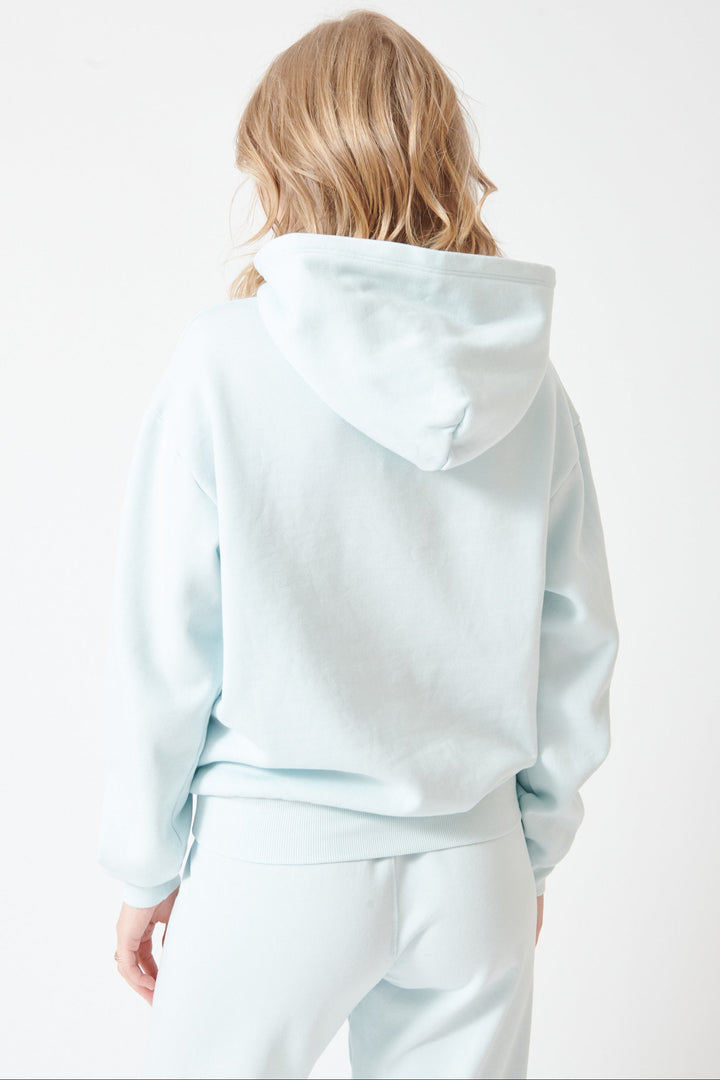 Madi wearing SPRWMN Heart Hoodie rear view