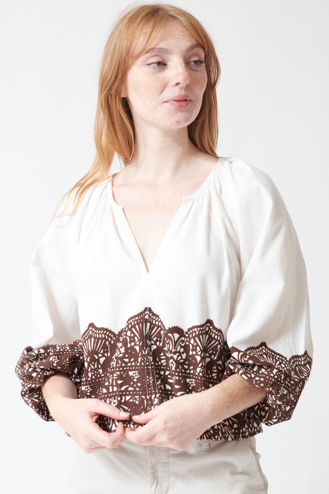 Waverly wearing The Great The Chariot Top in Cream with Western Lace, front view.