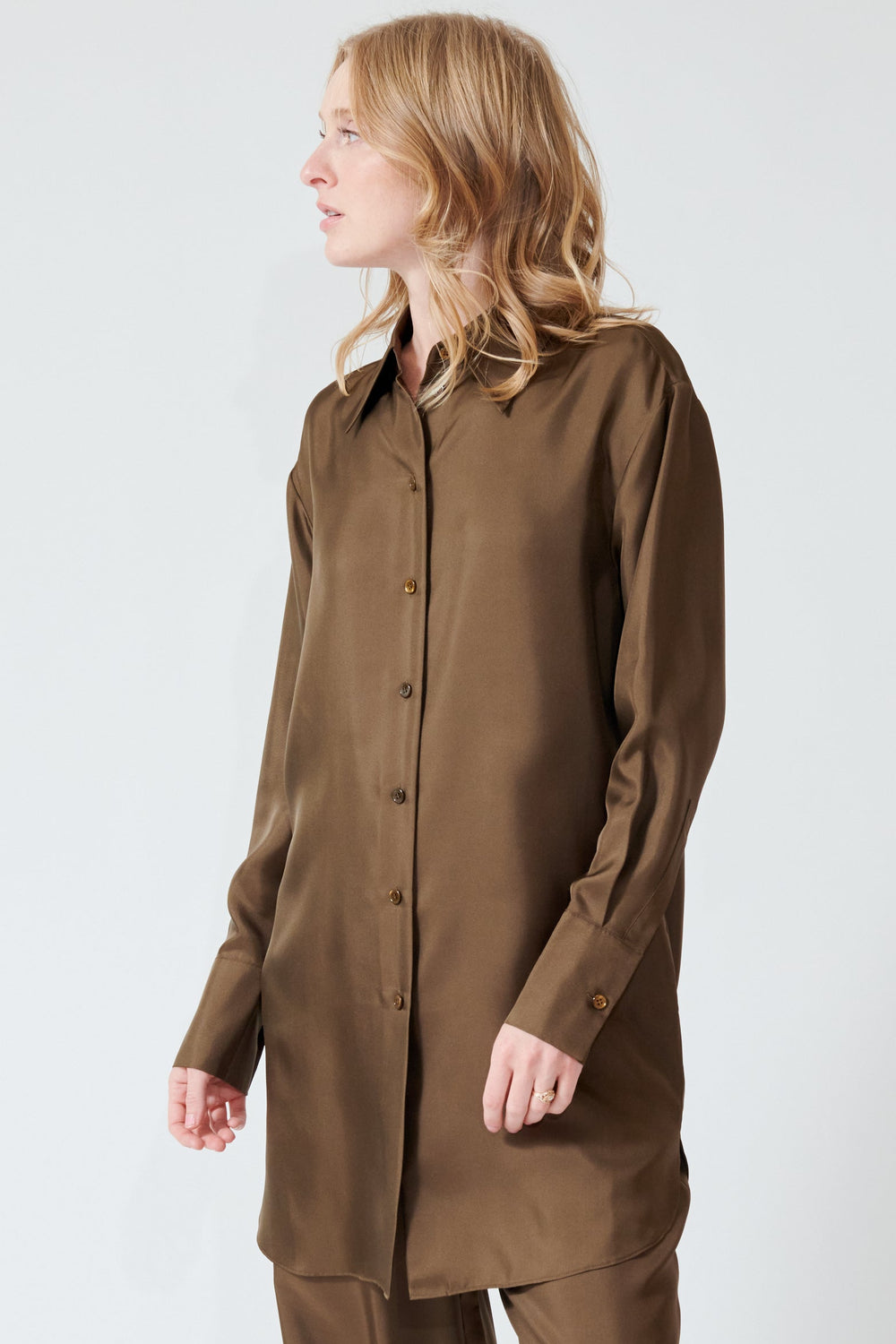Madi wearing Róhe Oversized Silk Shirt front/side view