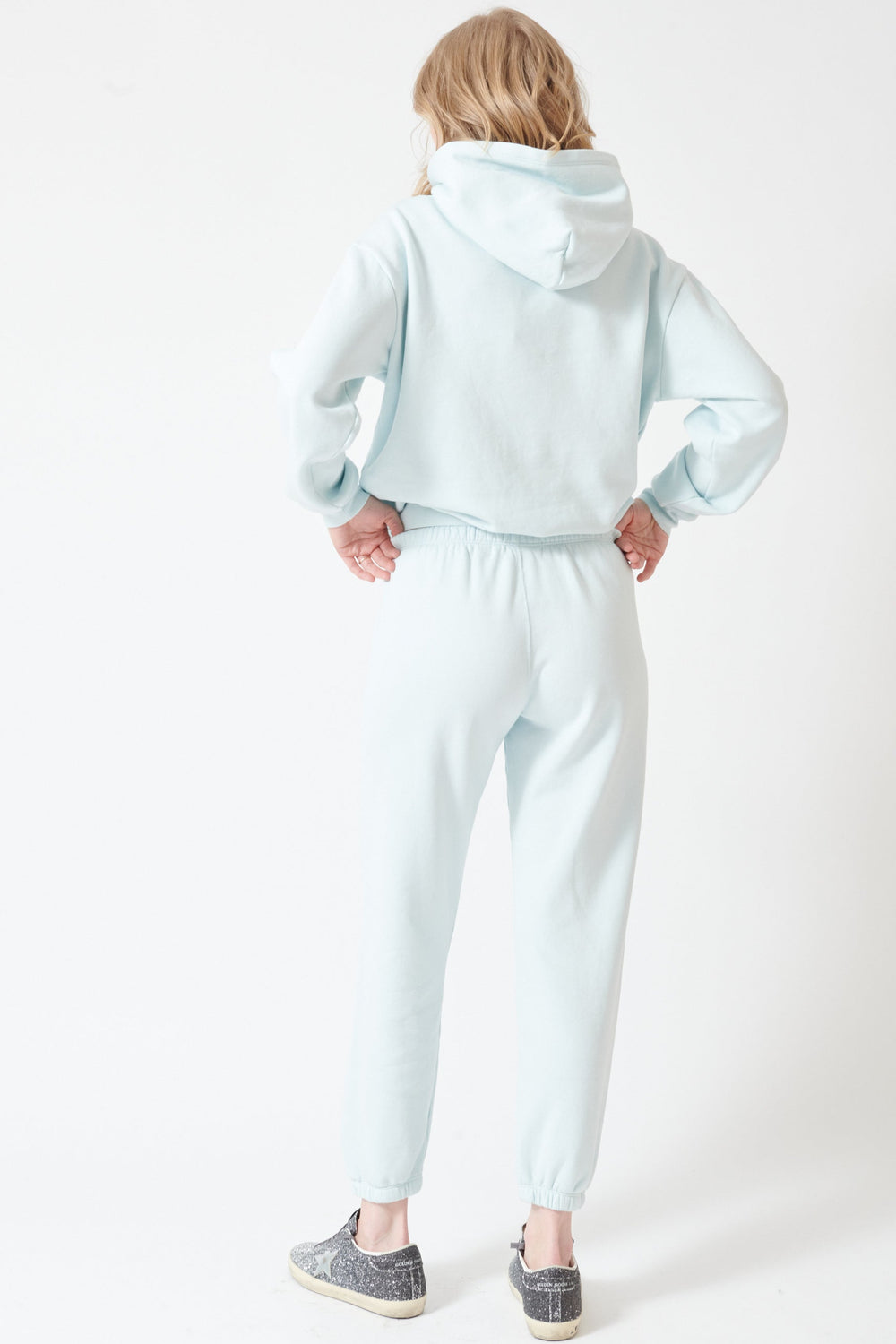 Madi wearing SPRWMN Heart Sweatpants rear view