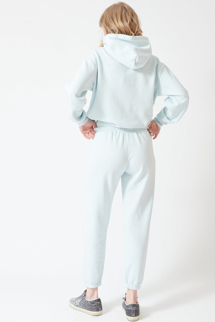 Madi wearing SPRWMN Heart Sweatpants rear view