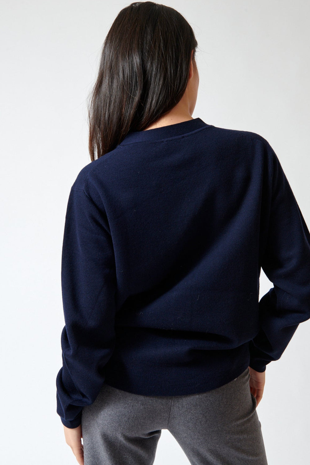 Lily wearing The Garment Bergen Dad Cardigan rear view