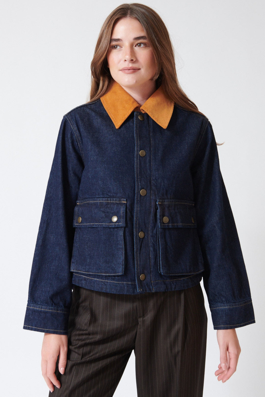 Julia wearing The Great The Denim Swingy Jacket in Midnight Rinse, rear view.