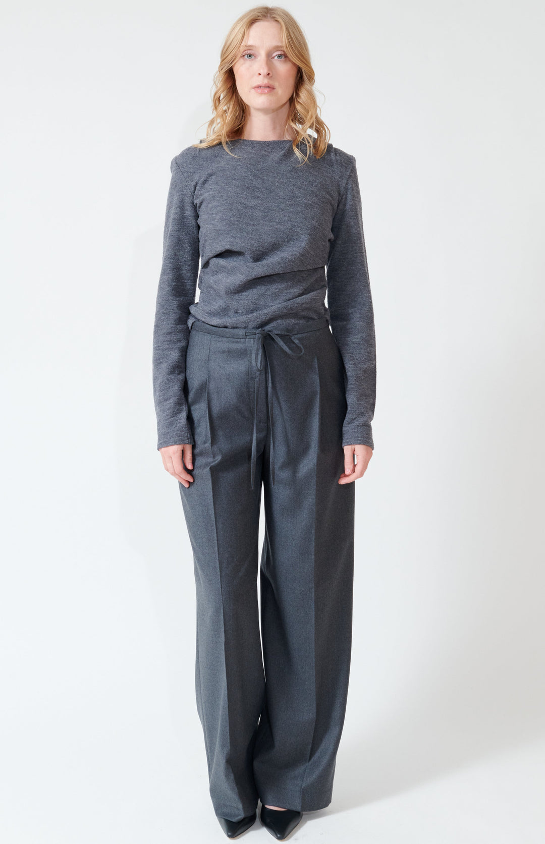 Madi wearing Róhe Relaxed Soft Wool Trousers front view