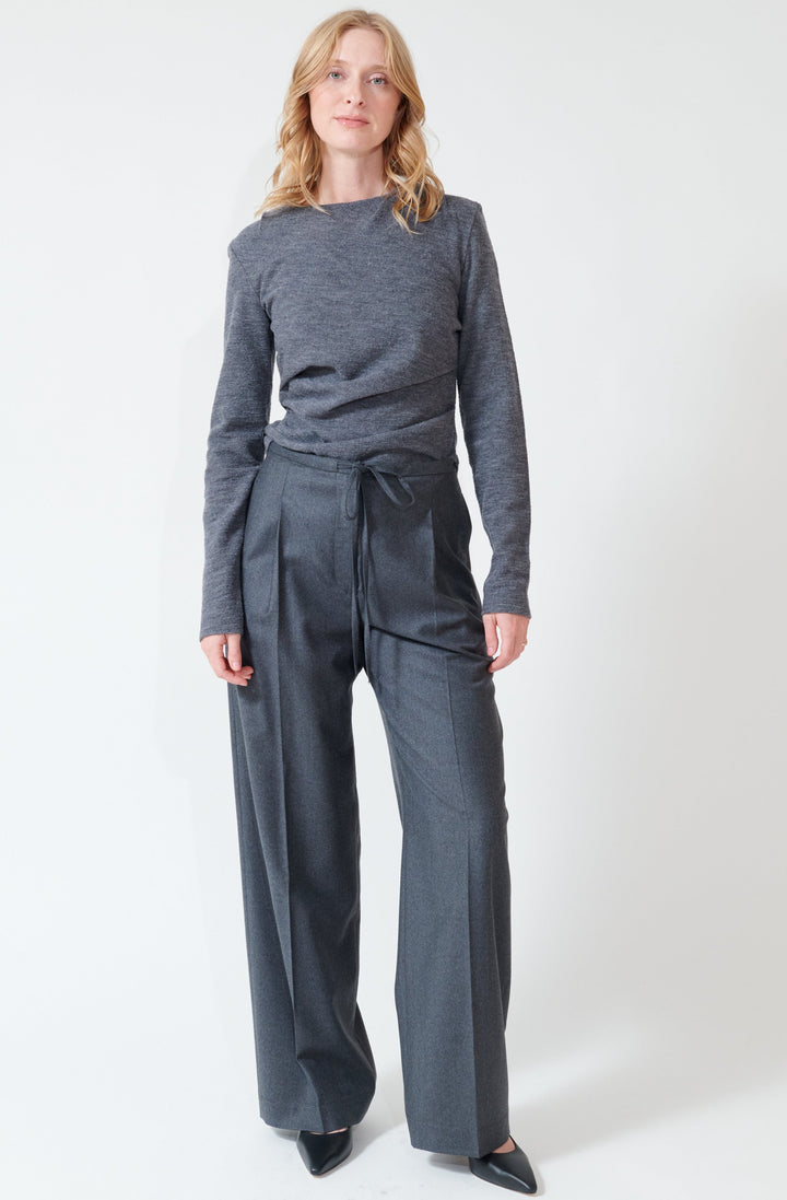 Madi wearing Róhe Relaxed Soft Wool Trousers front view