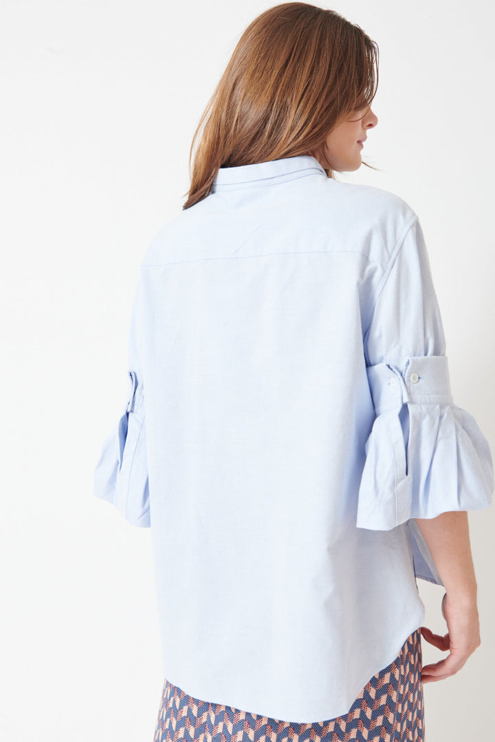 Julia wearing Odeeh Washed Oxford All About The Sleeves Shirt rear view