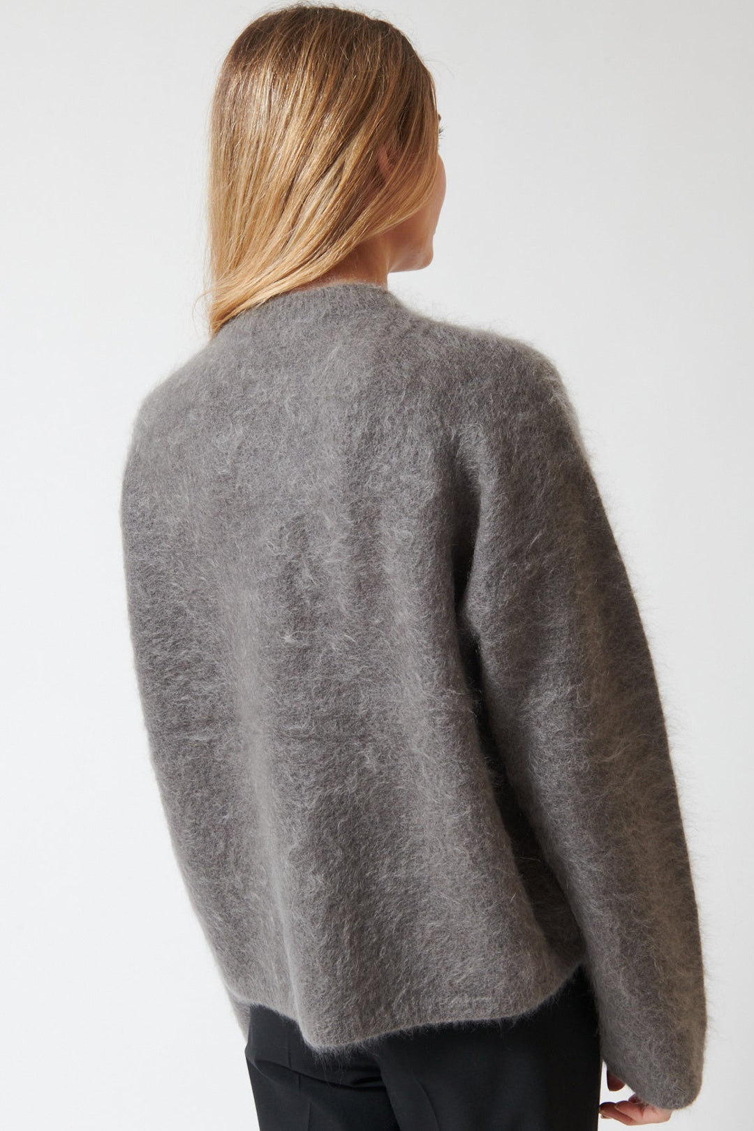 Mari wearing The Garment Roma Boyfriend Sweater rear view
