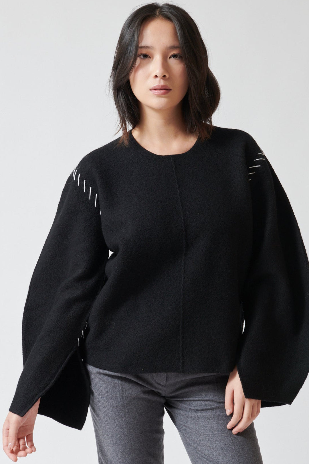 Lilly wearing The Garment Oslo Sweater front view